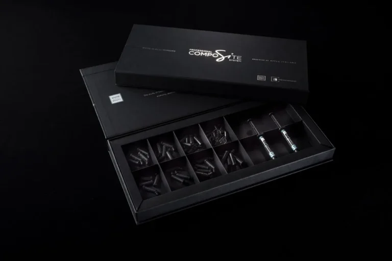 Black linen-effect rigid box for a dental implant instrument with two-colour foil-blocked branding