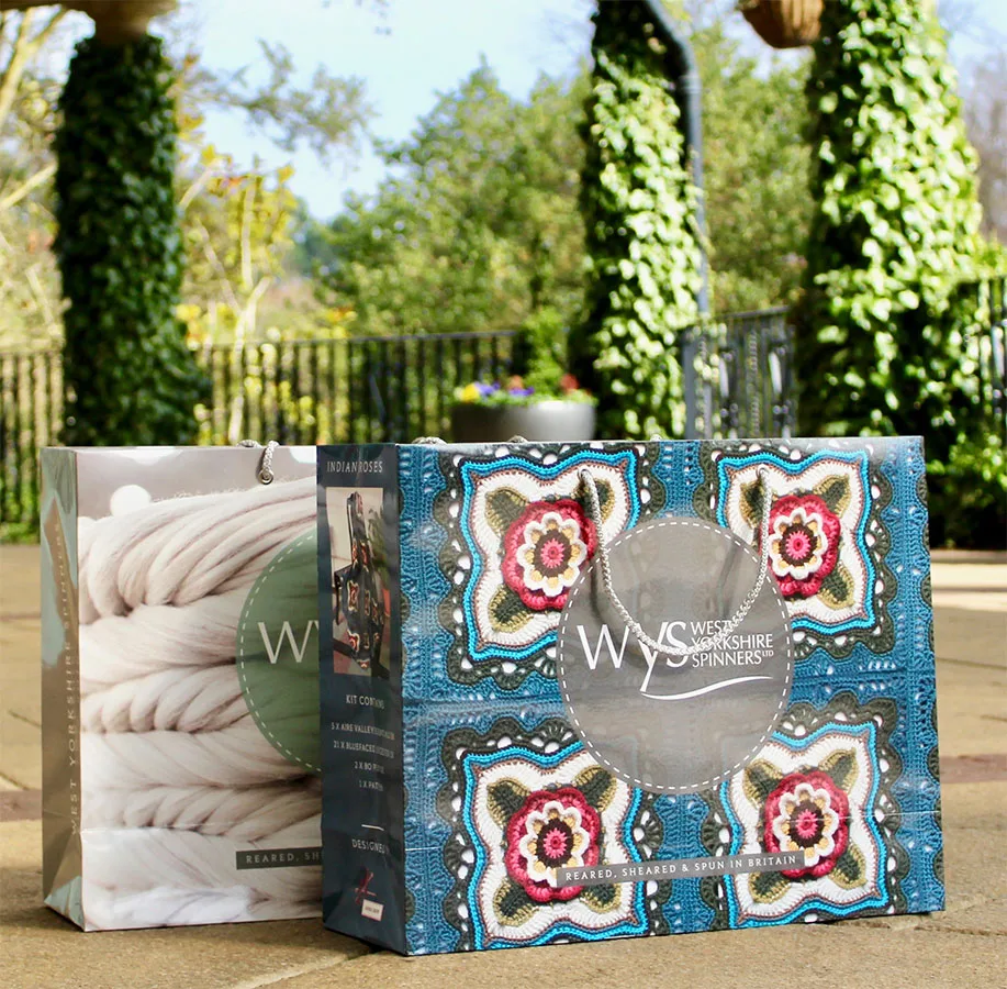 Branded printed paper carrier bags with rope handles